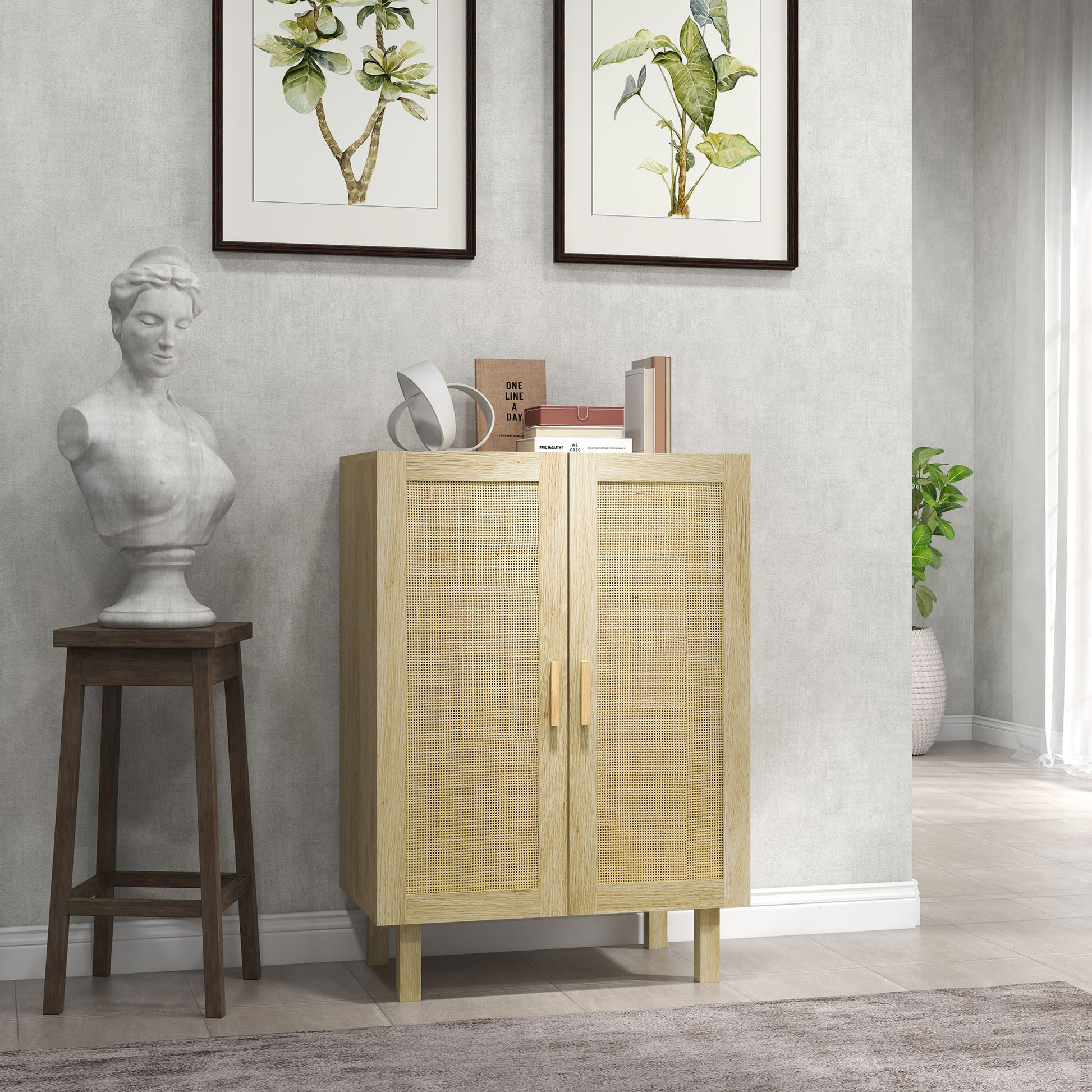 Light wood cabinet with decorative items in a room with a gray wall, plant, and statue.