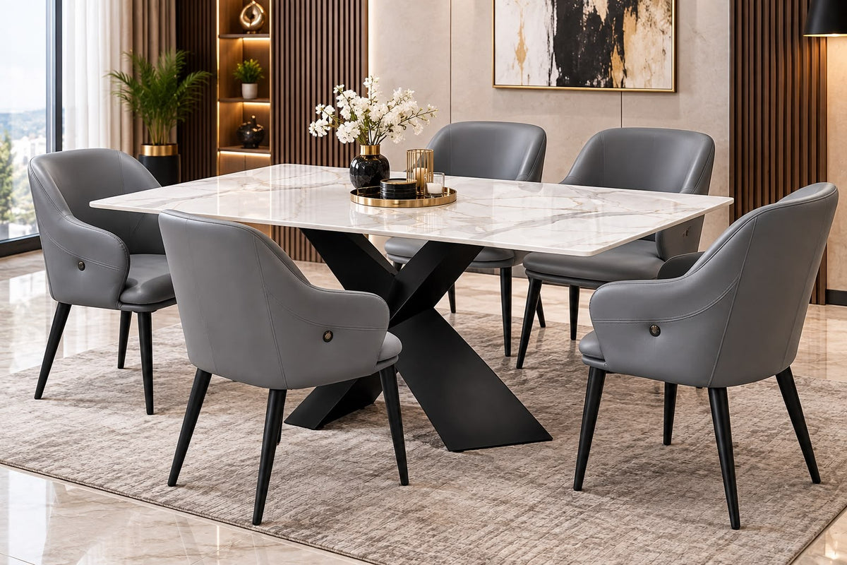 White marble-look dining table with black X-base and six grey chairs